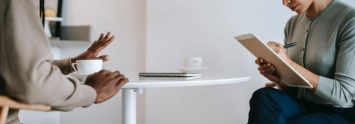 people sitting across a table from one another
